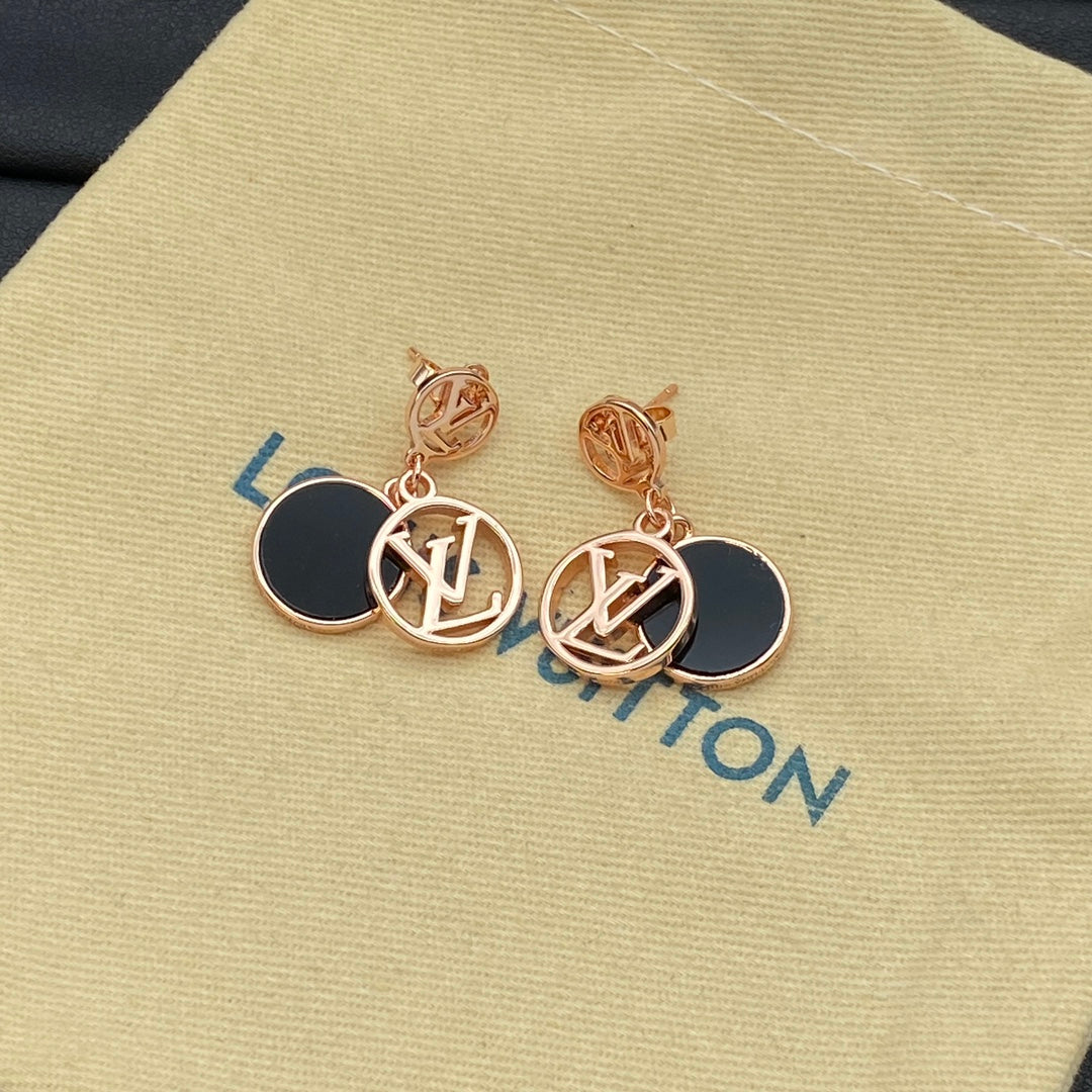Boucles d'oreilles en métal avec pendentif rond siglé