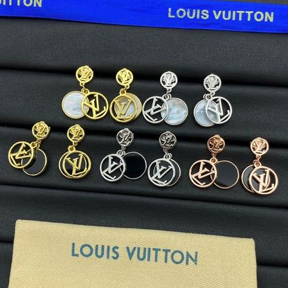 Boucles d'oreilles en métal avec pendentif rond siglé