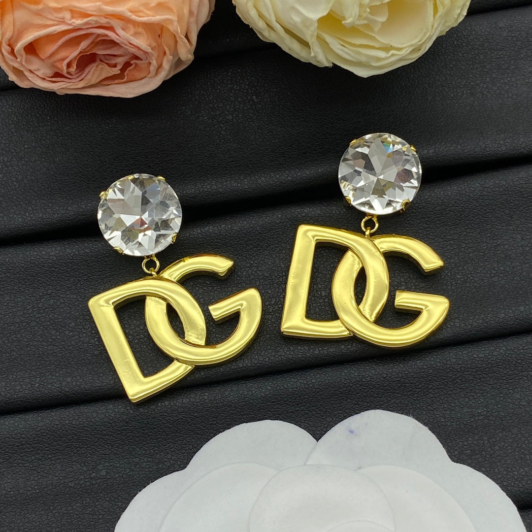 Boucles d'oreilles pendantes à logo doré