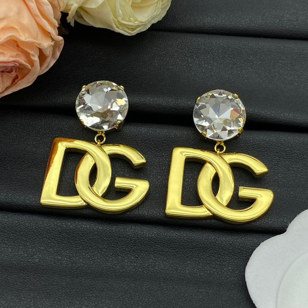 Boucles d'oreilles pendantes à logo doré