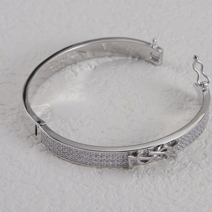 Jonc métallique avec logo en forme de diamant