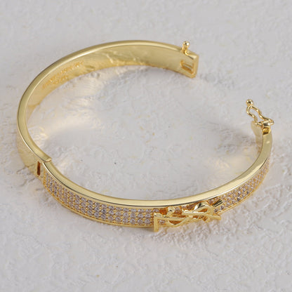 Jonc métallique avec logo en forme de diamant