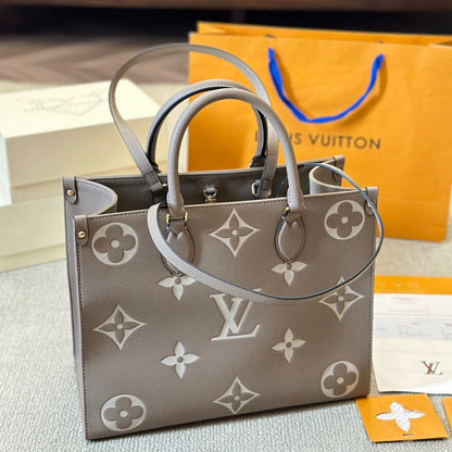 Bolso tote Onthego de cuero gris repujado