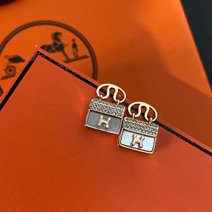 Boucles d'oreilles pendantes sac en métal H
