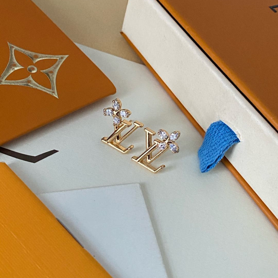 Boucles d'oreilles clous élégantes avec logo floral en cristal