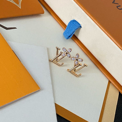 Boucles d'oreilles clous élégantes avec logo floral en cristal