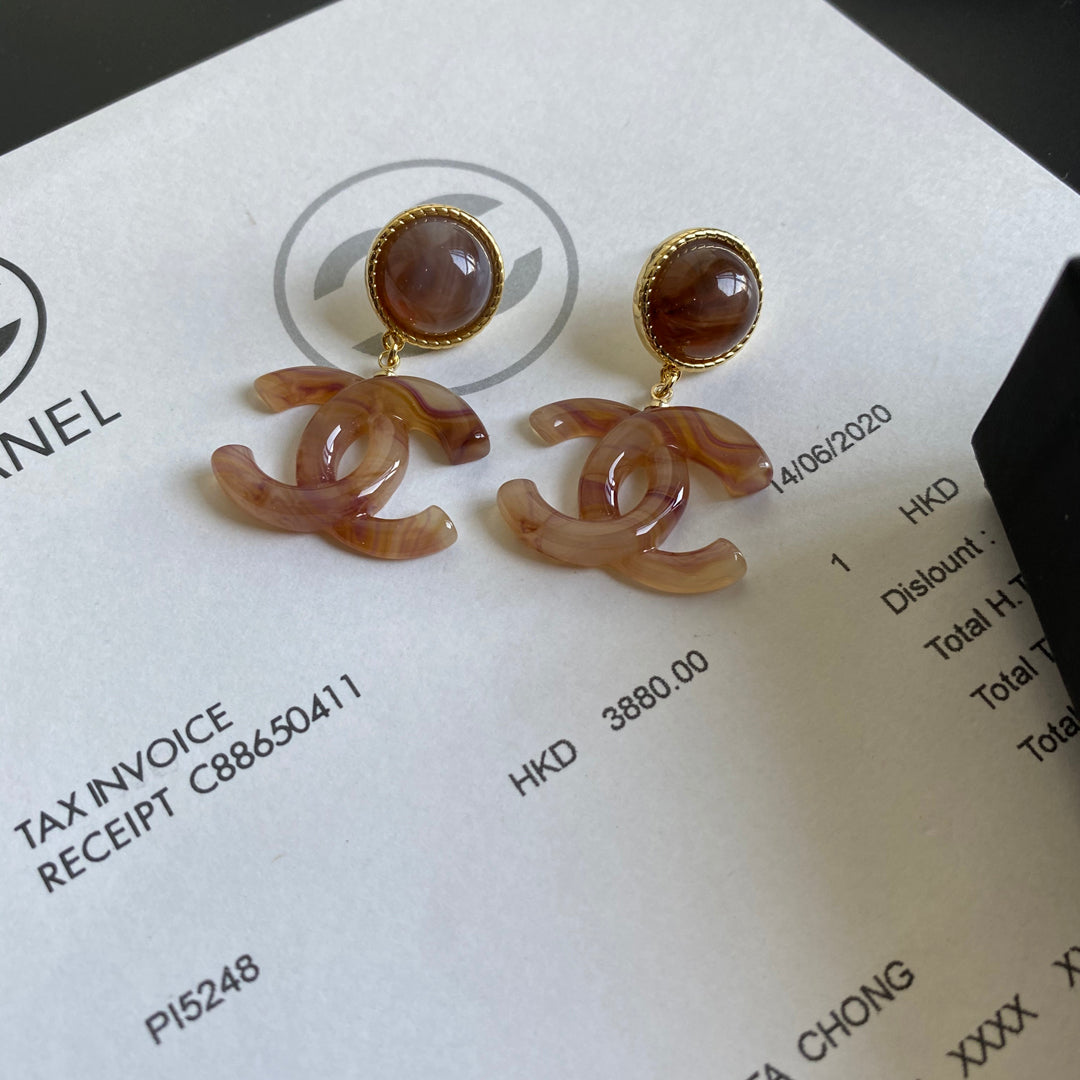 Boucles d'oreilles pendantes logo ambre vintage