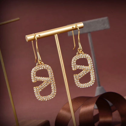 Pendientes metálicos Signature con logo totalmente de diamantes