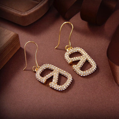 Pendientes metálicos Signature con logo totalmente de diamantes
