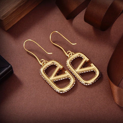 Pendientes metálicos Signature con logo totalmente de diamantes
